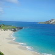 Hawaii vacation spot: White sandy shore with calm waves
